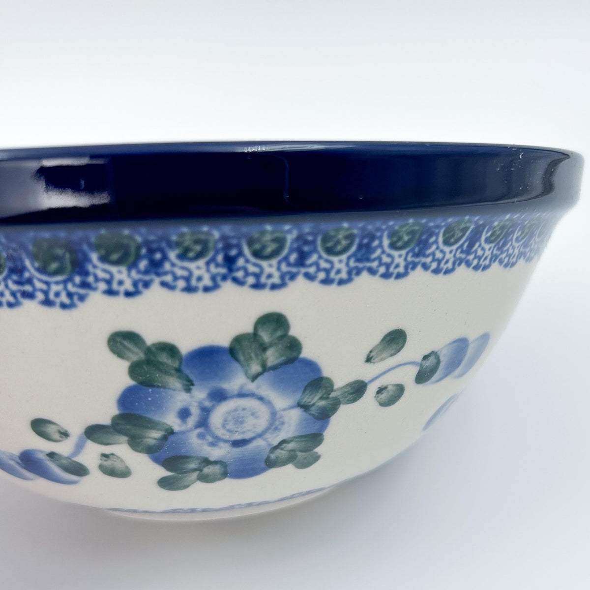 Close-up of interior floral detail on Blue Poppies stacking bowl