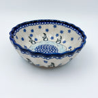 Snowman Penguins Design shell bowl, front view showing snowman figures around blue starburst center