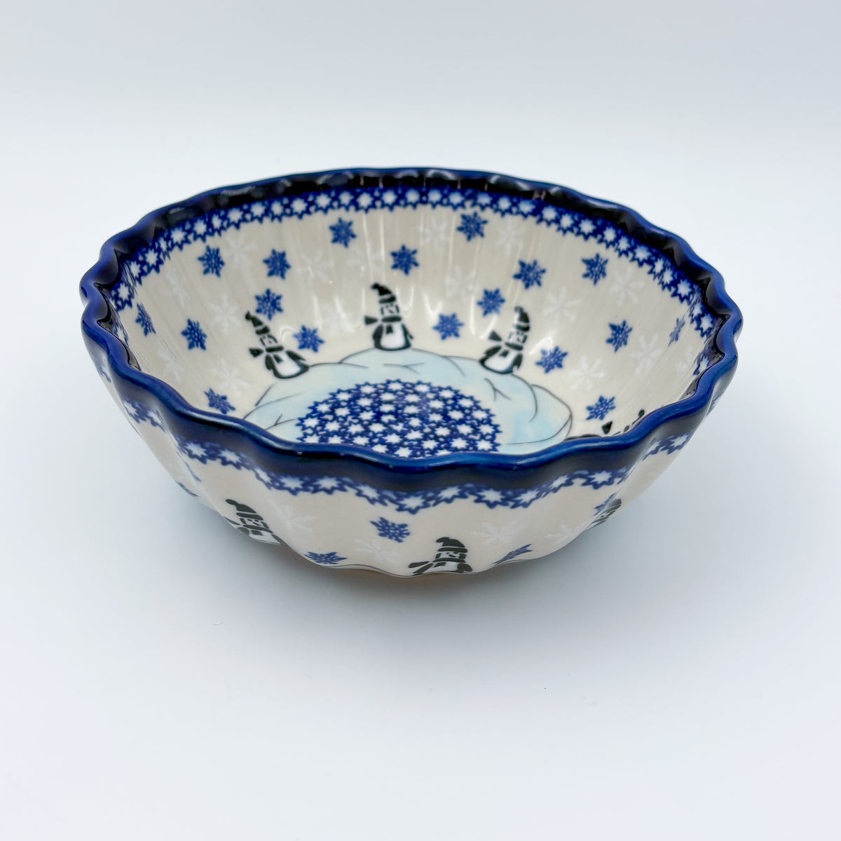 Snowman Penguins Design shell bowl, front view showing snowman figures around blue starburst center