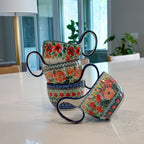Maraschino loop-handle bowl stacked with three other patterned bowls on a kitchen counter