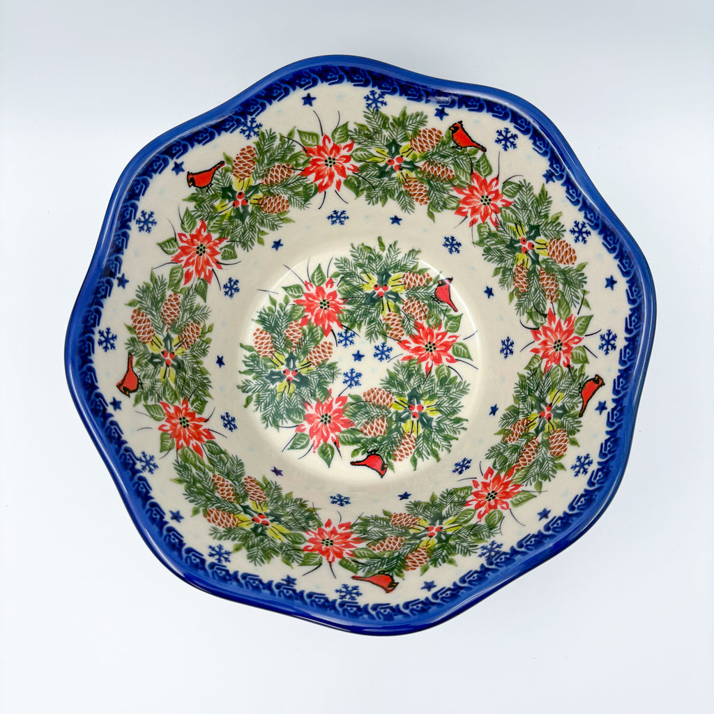 Christmas Cardinals wavy bowl, top-down view showing double wreath of poinsettias, pinecones, and cardinals