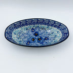 UNIKAT Deep Winter oval bowl, front view showing blue pansy bouquet with rose border