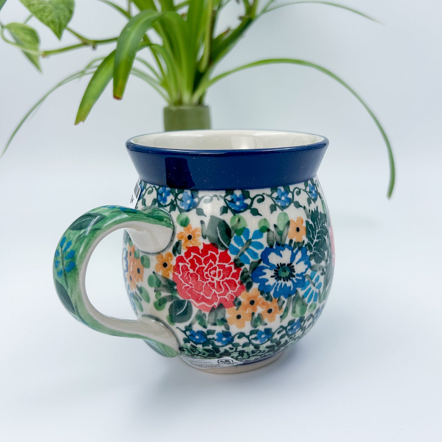 12 oz Polish Pottery floral UNIKAT bubble mug is made by talented artisans from Poland. 
Dimensions 5" x 3.66" x 3.78"
Ceramika Artystyczna Company