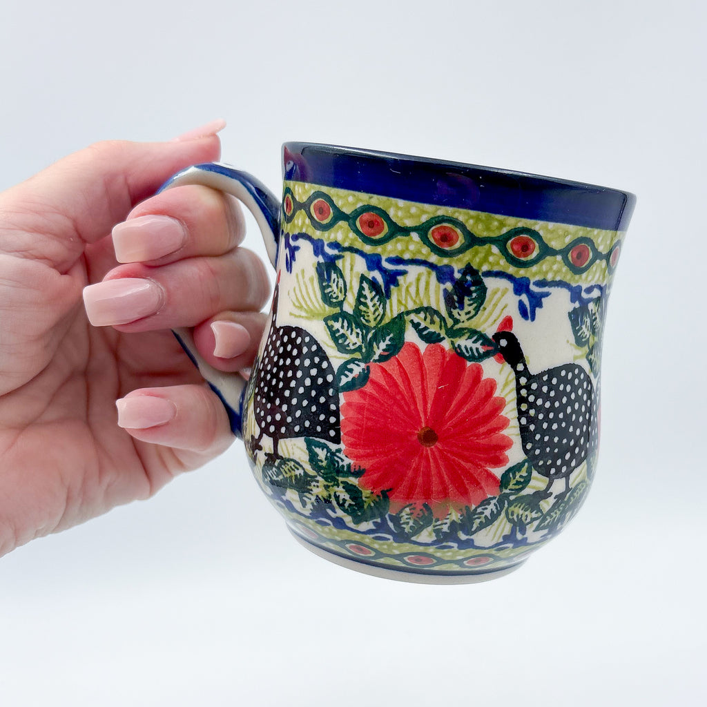 Fowls in Florals bubble mug held in hand, front view