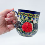 Fowls in Florals bubble mug held in hand, front view