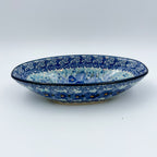 UNIKAT Deep Winter oval bowl, front view on oval foot showing blue pansy pattern and floral rim band