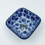 Misty Dragonfly square bowl, top-down angled view of dragonfly centered in blue floral pattern
