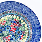 UNIKAT Splendid Meadow plate, close-up rim detail showing purple leaf border above floral bouquet