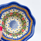 Mushroom Design scalloped bowl, close-up top view of mushroom and berry wreath detail held in hand