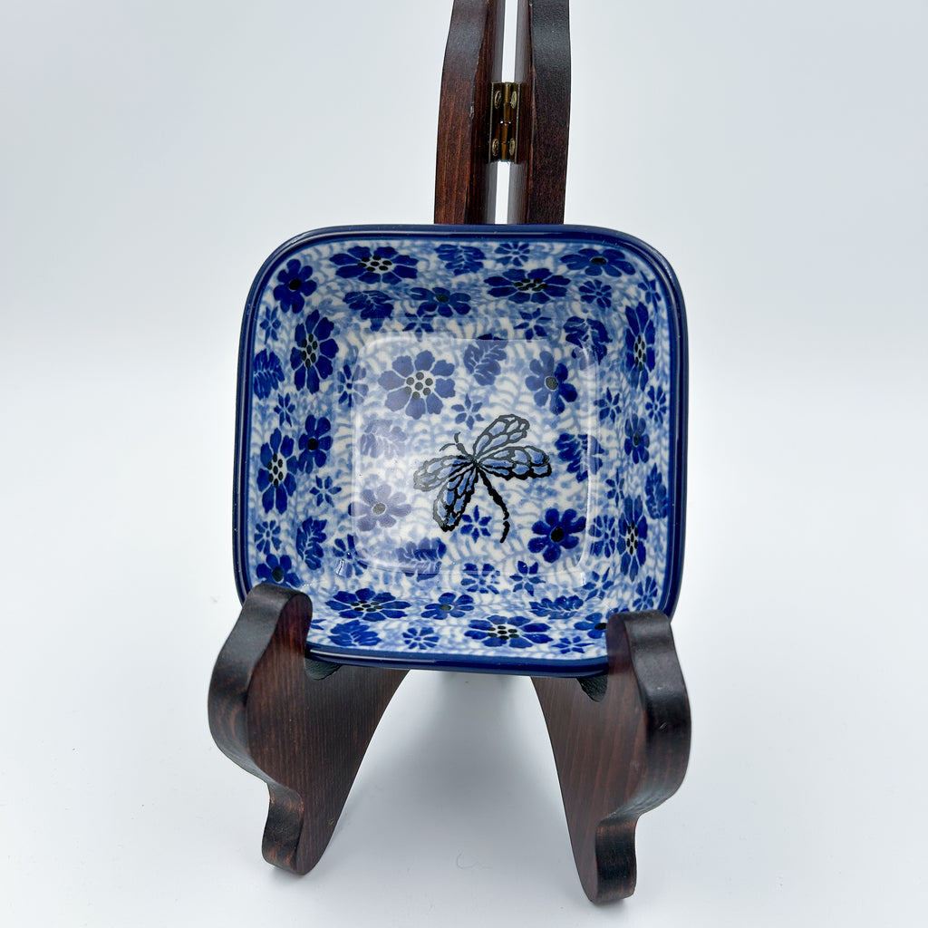 Misty Dragonfly square bowl, front view displayed on wooden stand showing dragonfly pattern