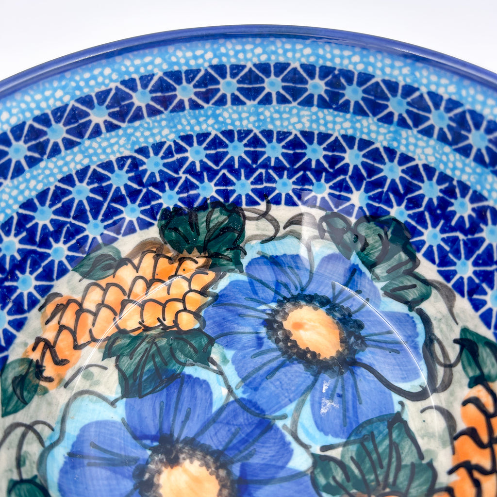 Close-up angled view of rim pattern and floral center on Corn in the Blue deep bowl