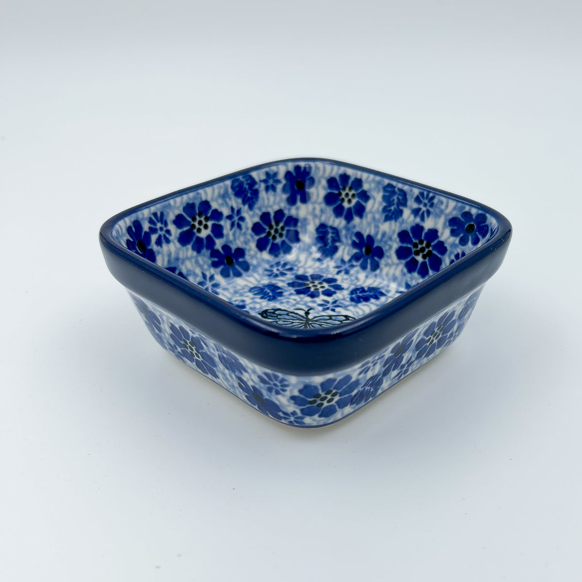 Misty Dragonfly square bowl, front view showing dragonfly and blue floral pattern on square rim