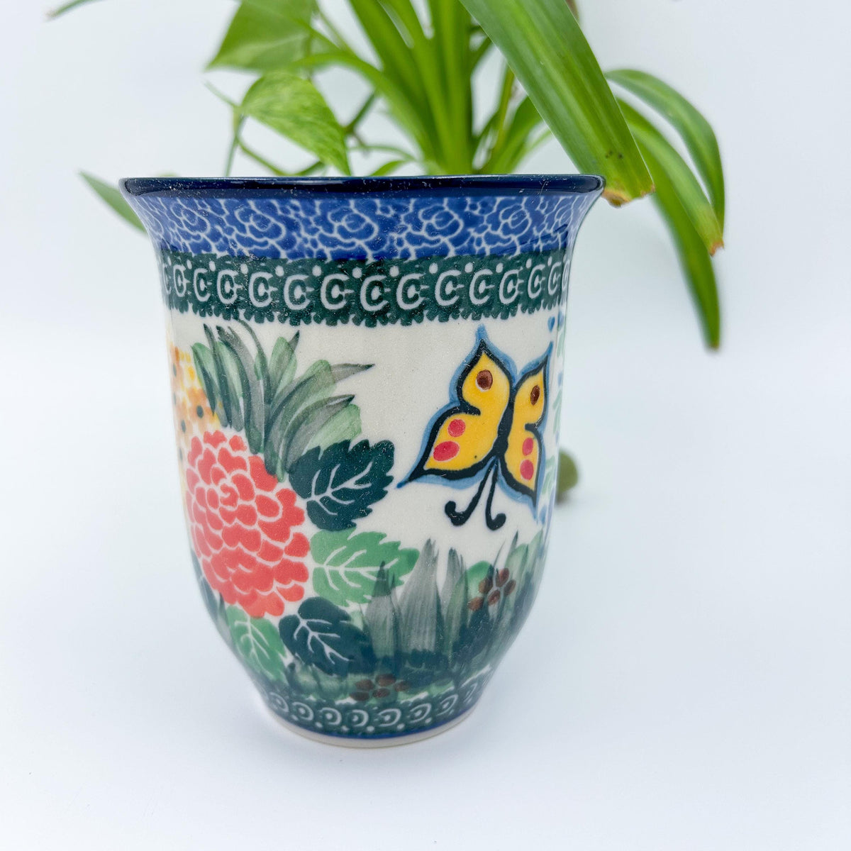 Spring Garden bistro mug on white background, front view showing pink hydrangea and butterfly