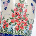 Close-up of red berry pattern on XL mug