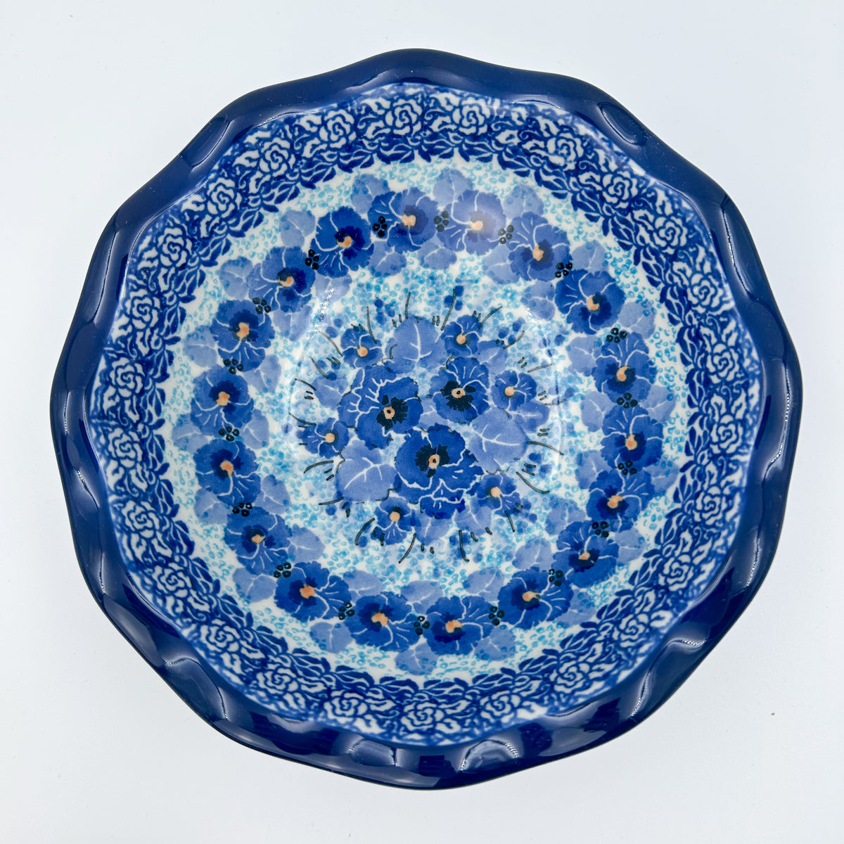 Deep Winter scalloped bowl on white background, top-down straight-on view