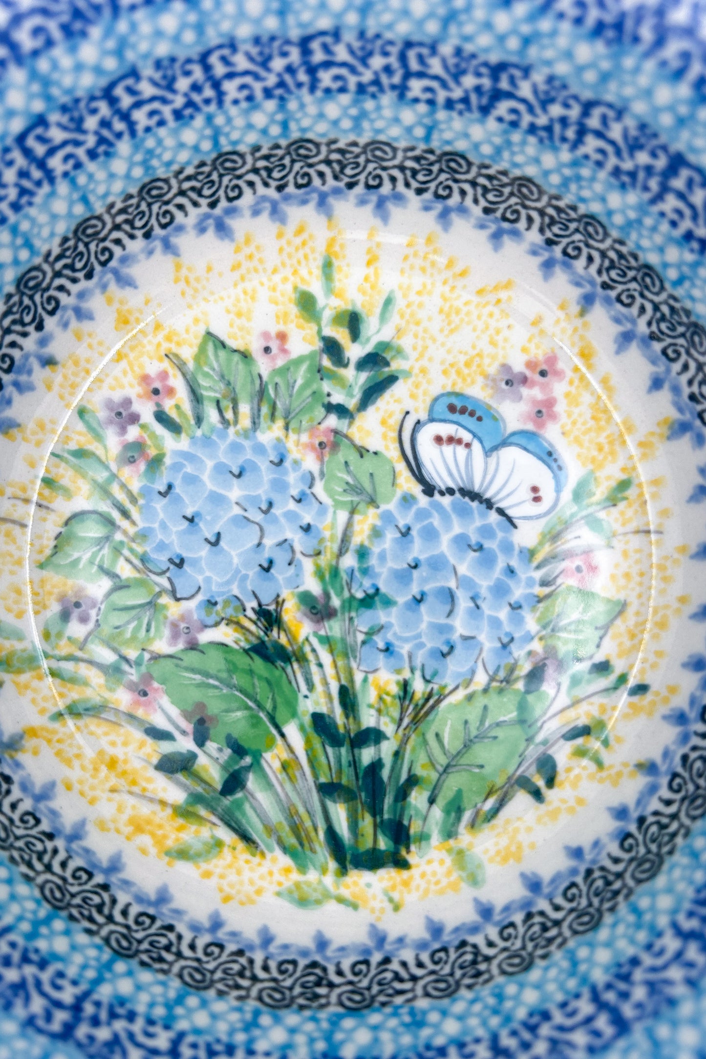 Polish pottery 6.57” blue floral stacking bowl in the UNIKAT &nbsp;Blue Hydrangea Pattern.  It holds 24 ounces of fluid Dimension
Ceramika Artystyczna Company