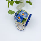 Blue Pansy bubble mug tipped on its side showing painted pansy pattern