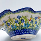 Close-up angled view of rim showing bluebells and bees on Bluebell Meadow wave bowl