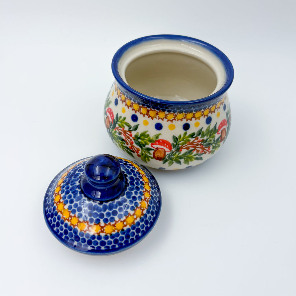 Iza sugar bowl, Mushroom Design, lid removed beside open bowl showing interior and mushroom wreath