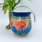 Garden Delight bubble mug on white background, front view showing red and blue florals