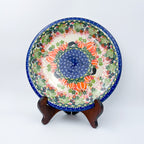 UNIKAT Hedgehog and Pumpkins plate, front view displayed on wooden stand showing pumpkin ring and hedgehogs
