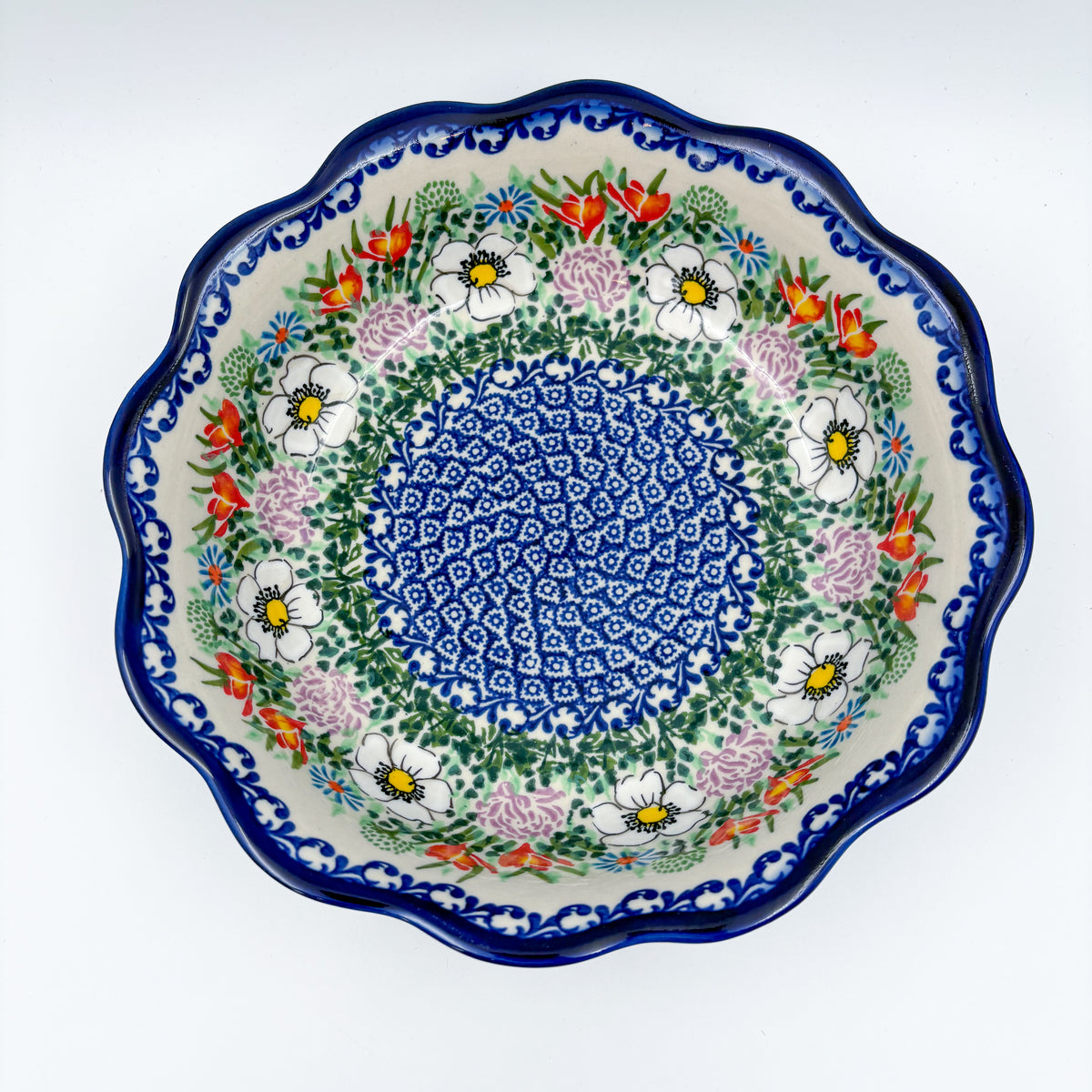 Cottage Garden Kora bowl on white background, top-down straight-on view