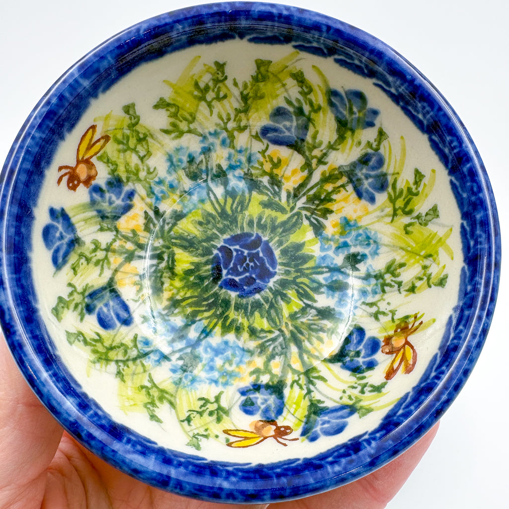 Close-up of largest bowl in Bluebell Meadow stacking set, held in hand