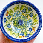 Close-up of largest bowl in Bluebell Meadow stacking set, held in hand