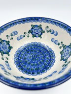 Blue Poppies stacking bowl, angled front view showing full interior pattern