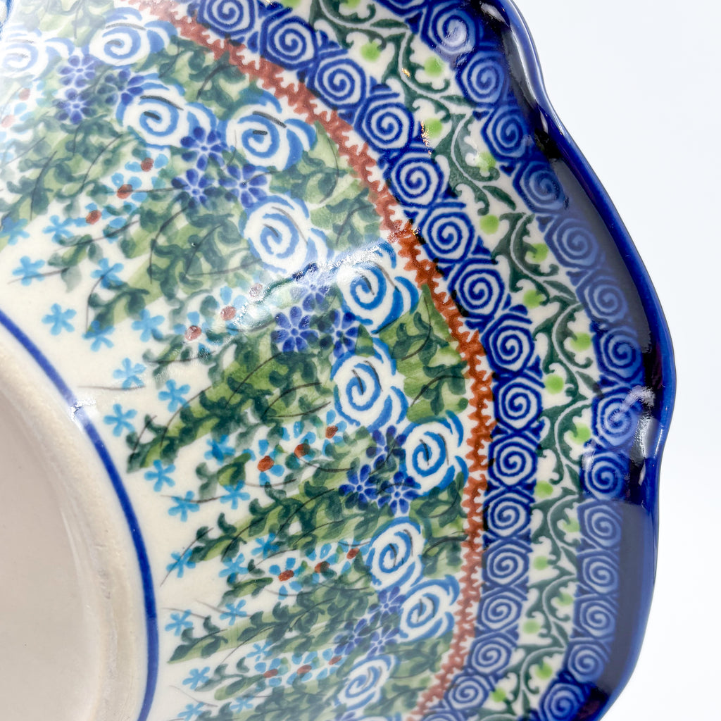 Close-up angled view of spiral rim border on Whispering Ferns wave bowl