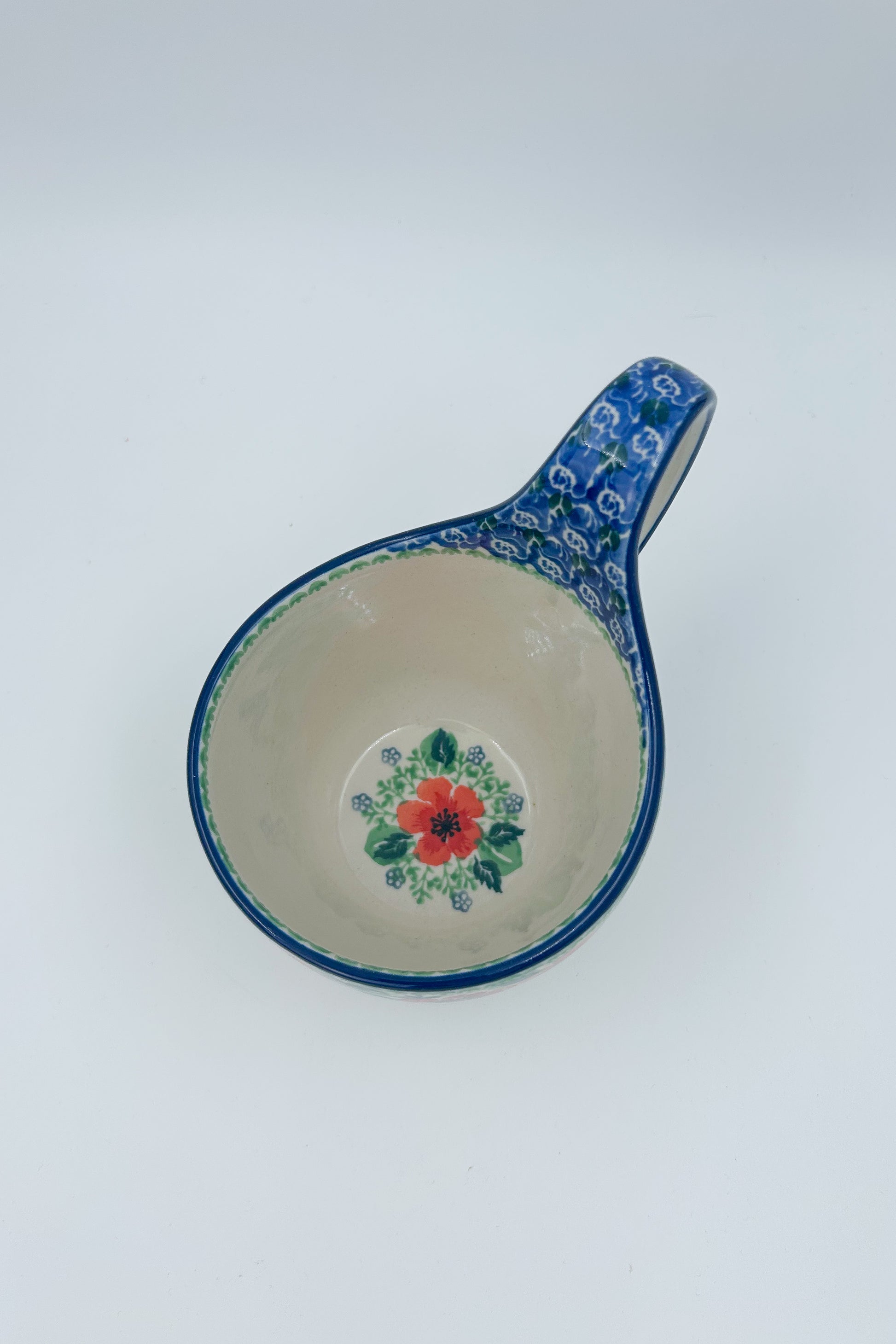 Polish pottery 16oz bowl with loop handle in the UNIKAT Candy Red Poppy pattern. It holds 16 oz of fluid.
Ceramika Artystyczna Company