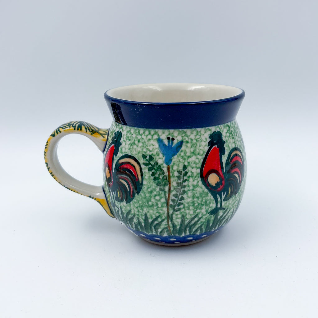 Rooster Parade bubble mug on white background, angled view with handle