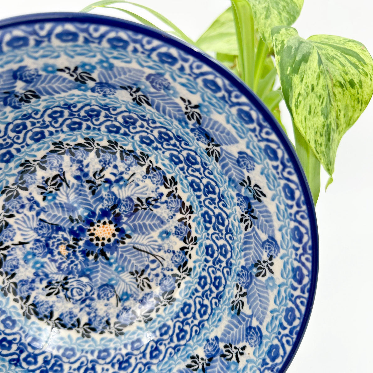 Close-up angled view of center medallion on Fields of Blue stacking bowl