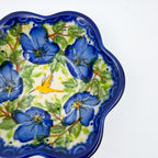 Close-up angled view of songbird detail on Blue Poppy Songbird flower-shaped bowl