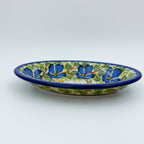 UNIKAT Blue Poppy Songbird oval Milano platter, front view showing blue poppy ring and scalloped rim