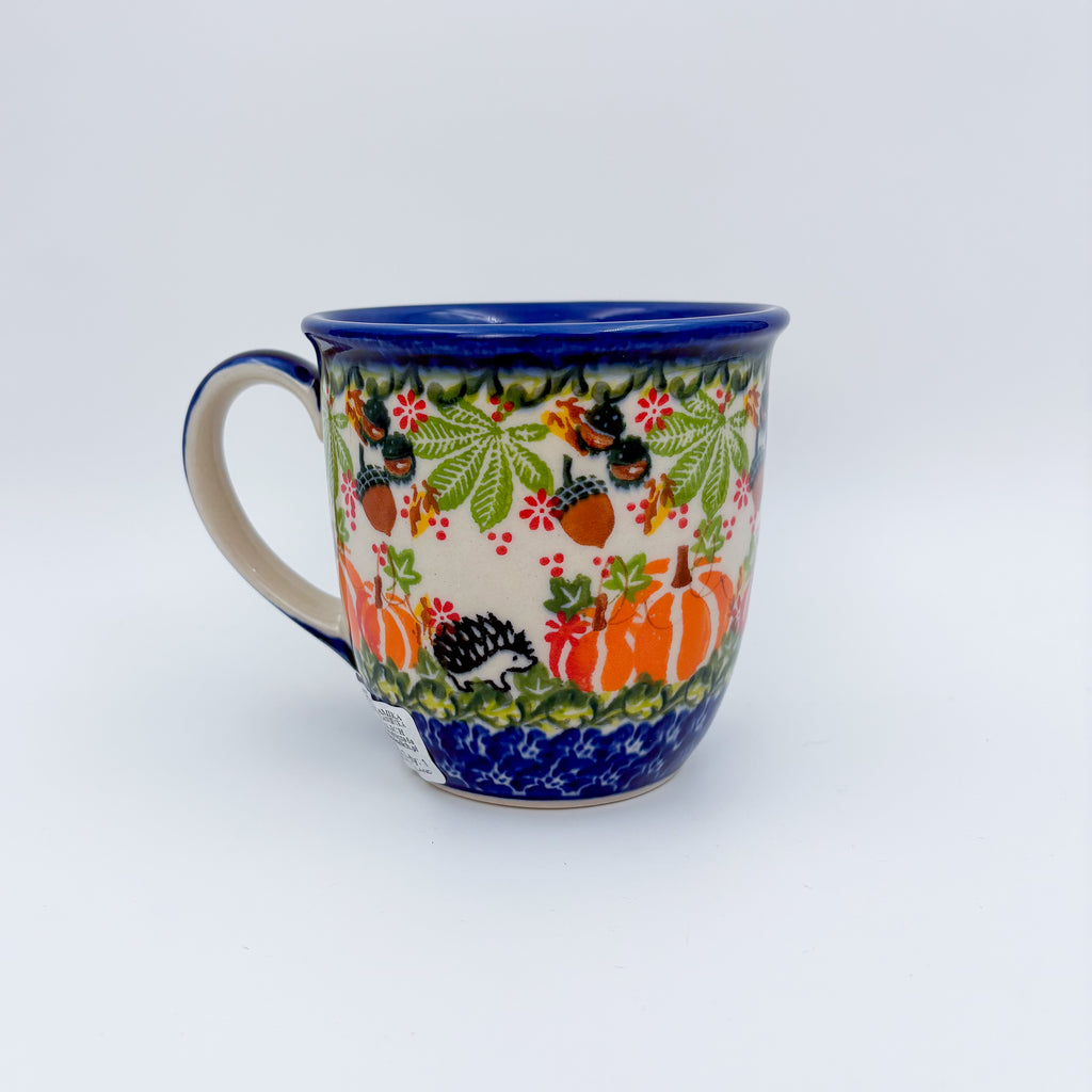 Hedgehog and Pumpkins Viking mug on white background, angled front view