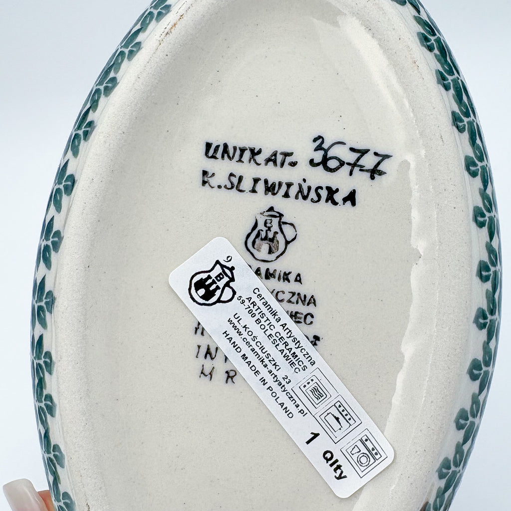 Bottom of Lime Bouquet oval bowl showing Unikat stamp and artist signature