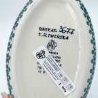 Bottom of Lime Bouquet oval bowl showing Unikat stamp and artist signature