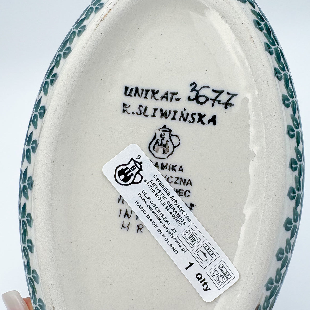 Bottom of Lime Bouquet oval bowl showing Unikat stamp and artist signature
