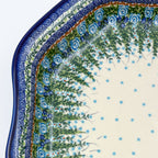 UNIKAT Whispering Ferns Clover platter, close-up corner view of fern spray border with blue rose scroll pattern