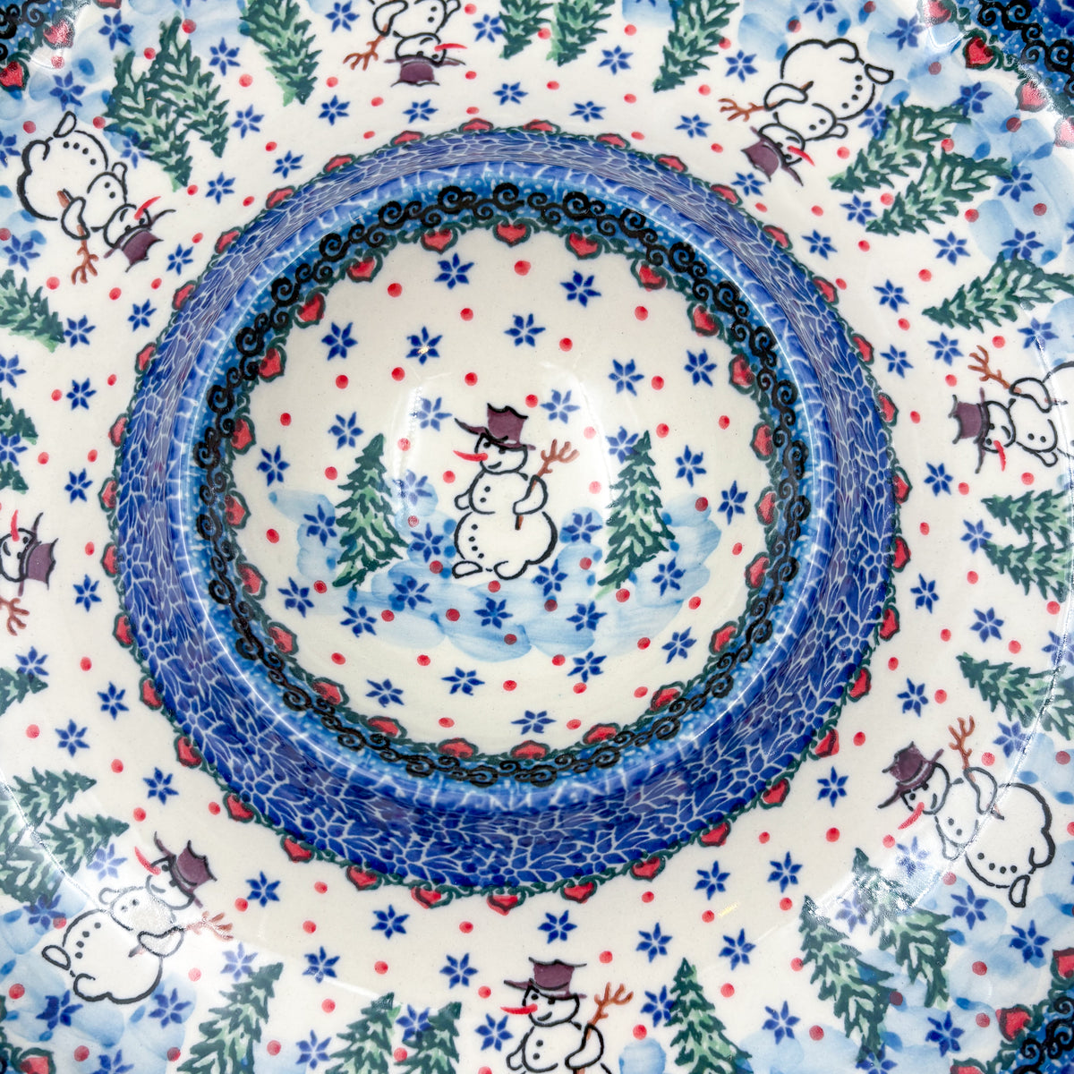 Dancing Snowman chip and dip platter, close-up top-down view of center dip bowl surrounded by snowmen and pine trees