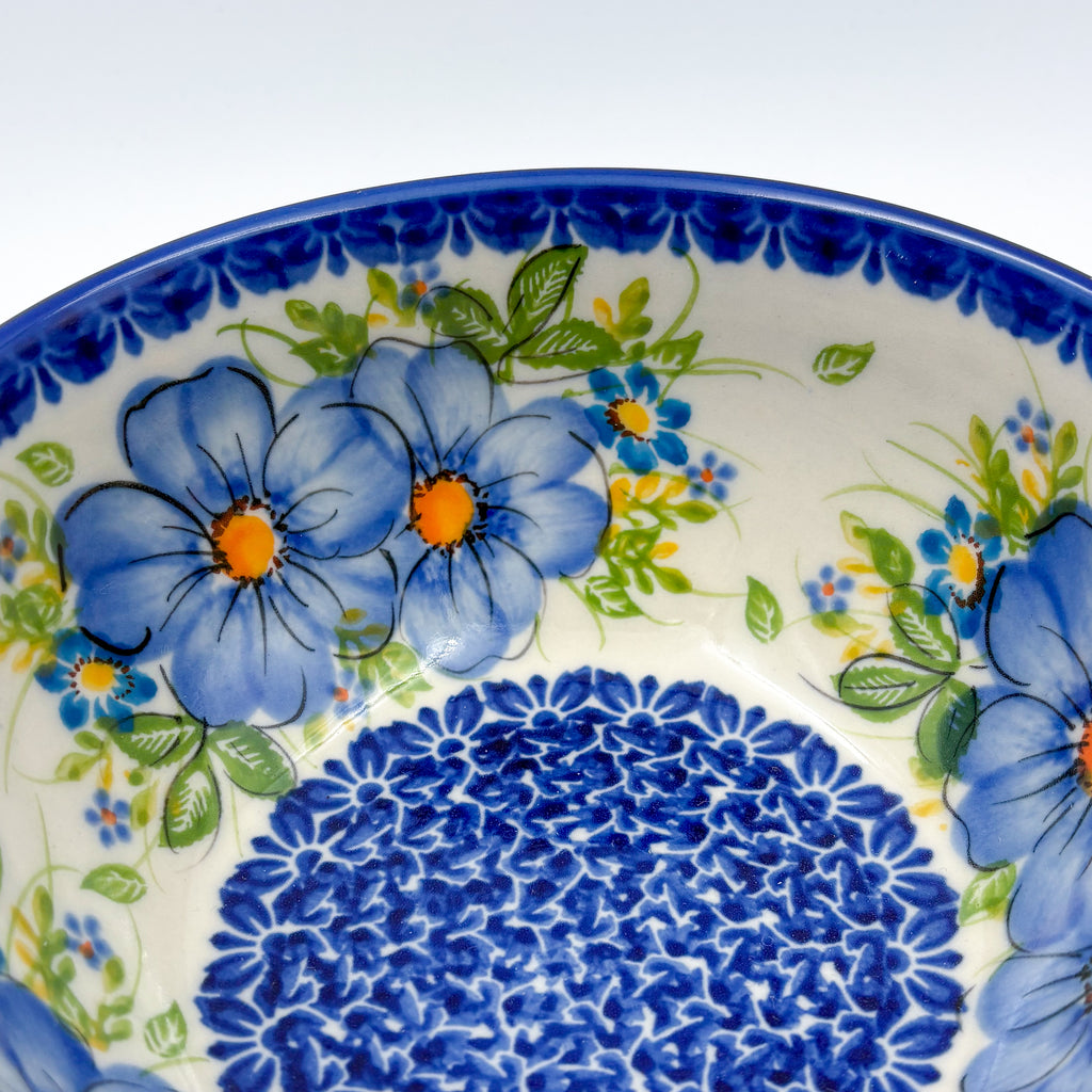 Blue Daisy bowl, close-up interior rim view of blue daisy flowers and blue dotted center