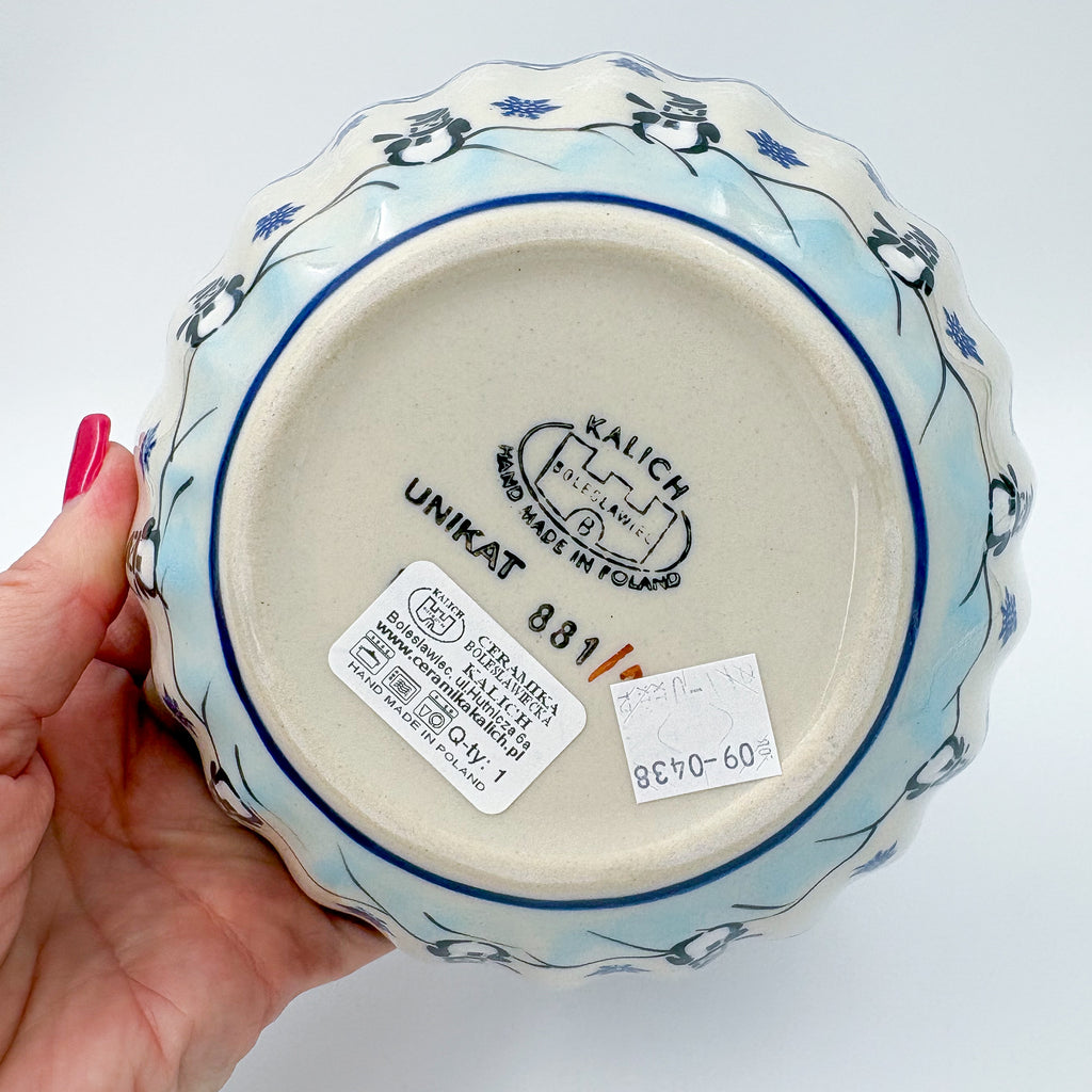 Snowman Penguins Design shell bowl, bottom stamp with Kalich Boleslawiec Unikat mark held in hand