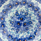 Close-up of pansy medallion center on Deep Winter scalloped bowl