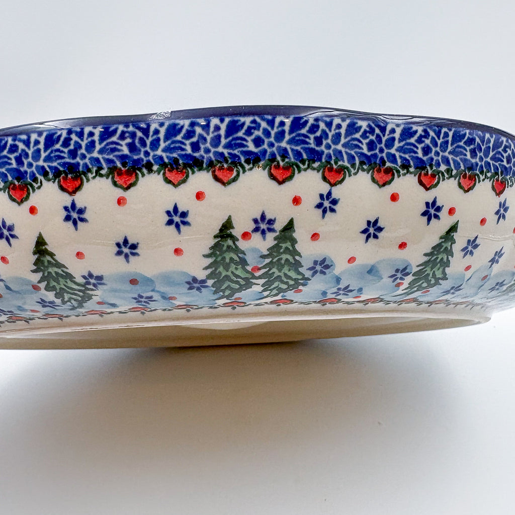 Dancing Snowman chip and dip platter, exterior side view showing pine trees and heart-dot border pattern