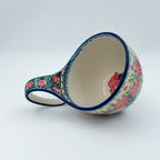 Polish pottery 16oz bowl with loop handle in the UNIKAT Robbin's Meadow pattern. 16 ounces of fluid.
6.26" x 4.49" x 5.51"
Ceramika Artystyczna Company