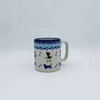 Puppy Pleasure mug on white background, front view showing dog silhouettes and bones