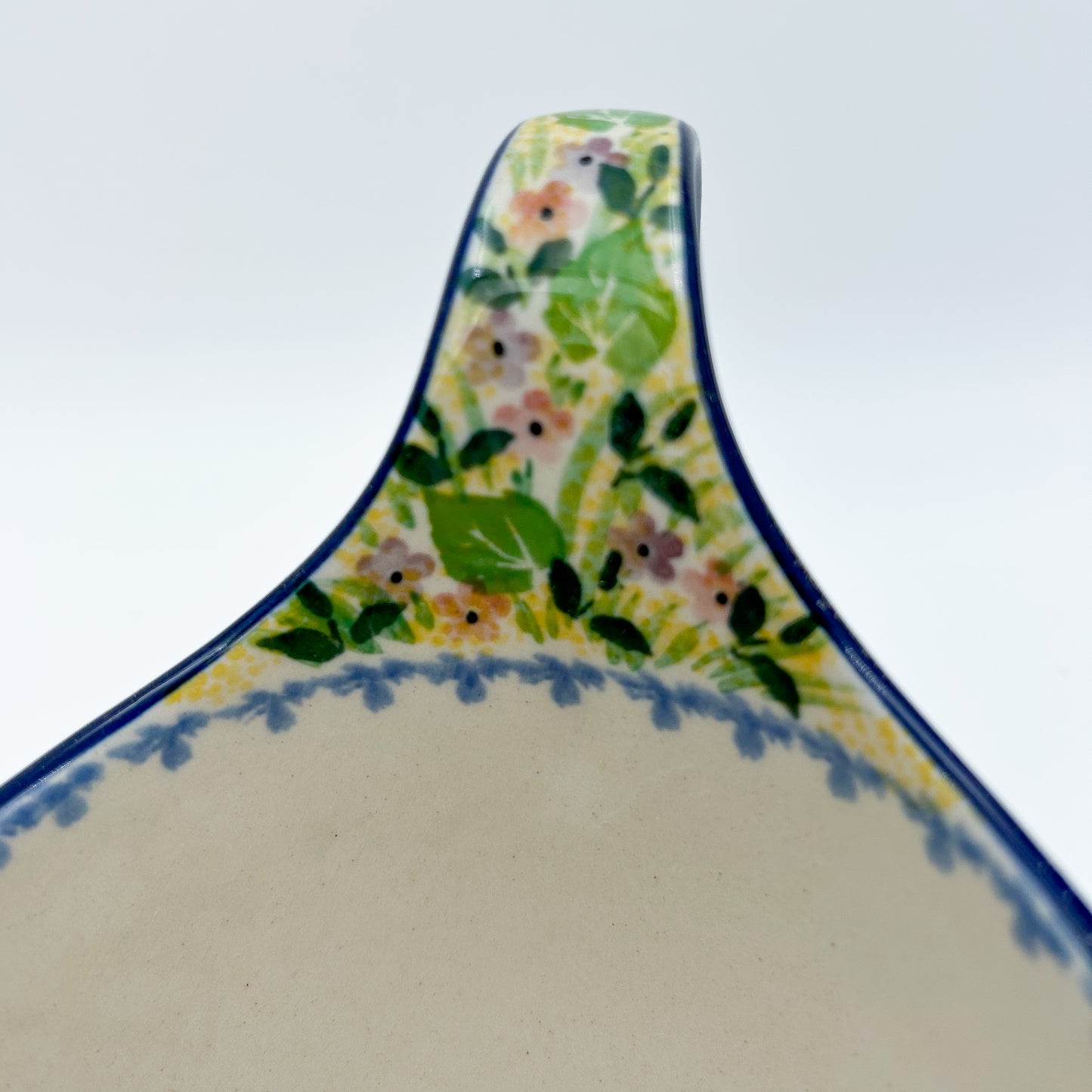 Polish pottery 16oz bowl with loop handle in the UNIKAT Blue Hydrangea pattern. This Polish Pottery bowl is made by talented artisans from Poland. 
6.26" x 4.49" x 5.51"
Ceramika Artystyczna Company