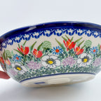 Cottage Garden handled bowl held in hand, side view showing exterior pattern