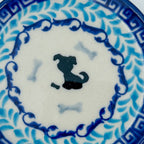 Puppy Plate, close-up top-down view of silhouette dog and bones on ivory center